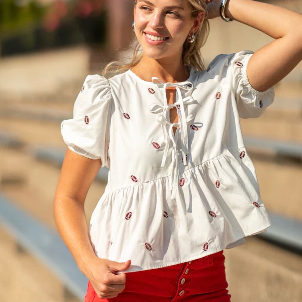 Pink Lily Football embroidered puff sleeve peplum top